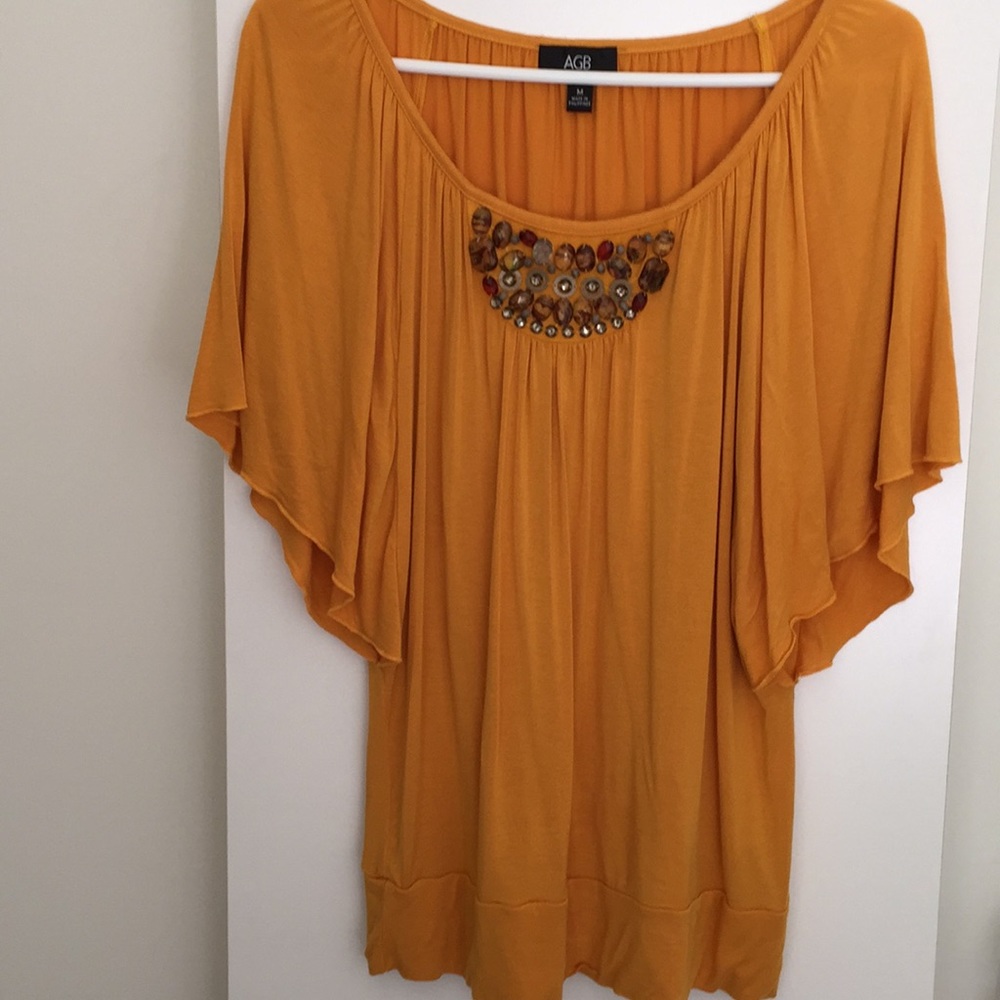 This is a never worn AGB brand ladies top. Quality